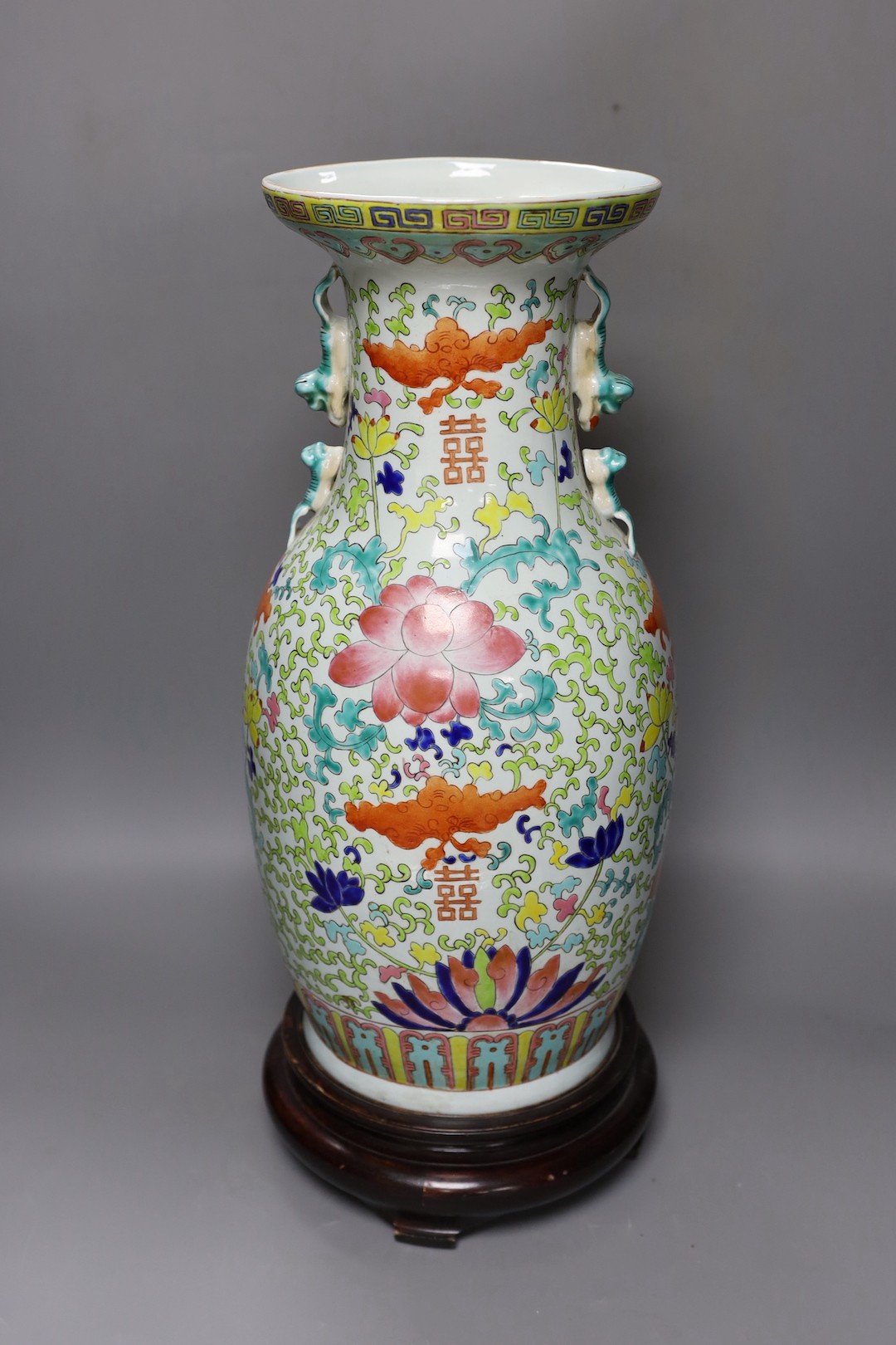 A large Chinese enamelled porcelain vase, on wood stand 53cm